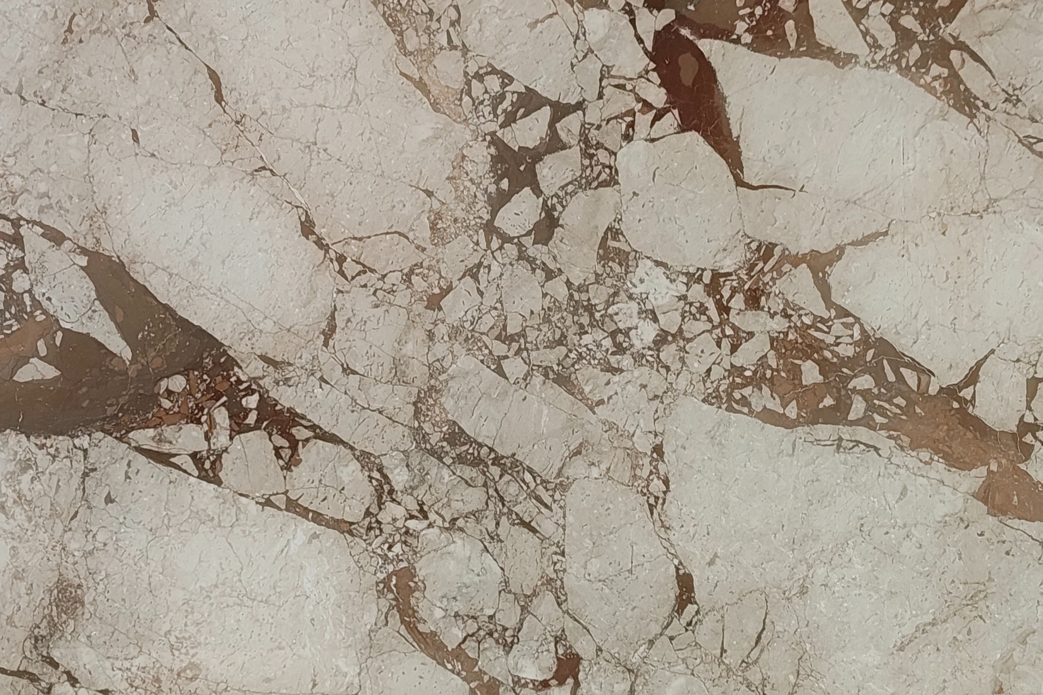 Gold Brescia marble slab in the Beautiful Beige collection